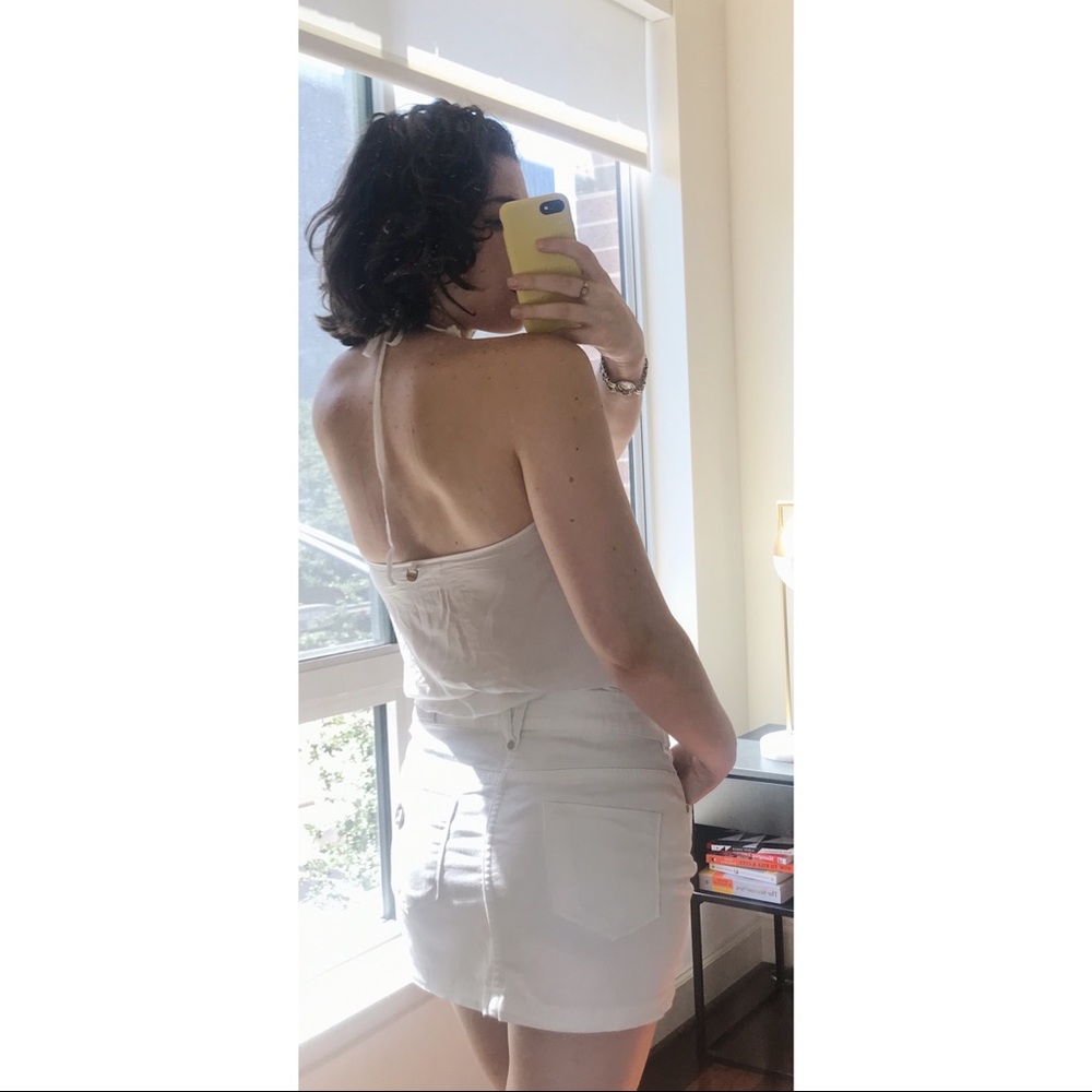 White button down top with knot in the front.